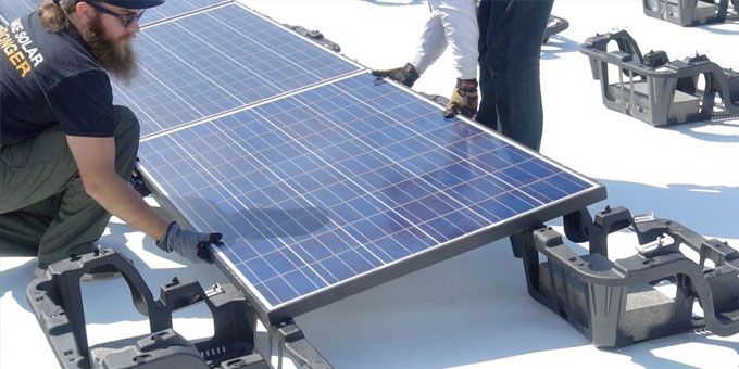 Choosing the Right Solution Solar on Flat Roofs – Ballasted, Attached & Hybrid